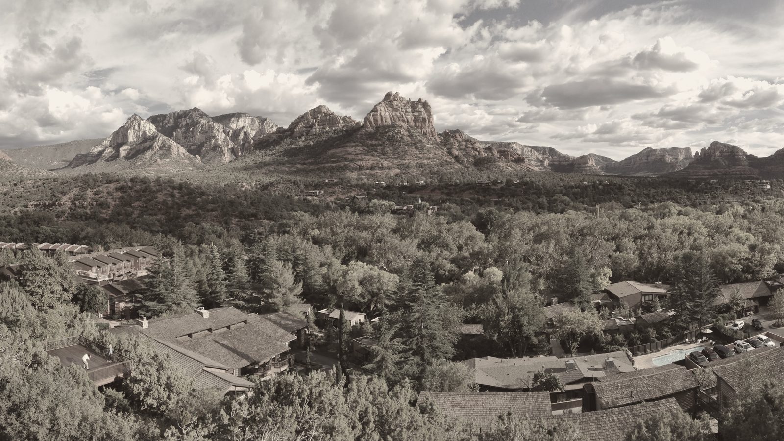 A wide, warm-toned view of the red-rock formations above Sedona, Arizona, the setting for James Arthur Ray's 2009 Spiritual Warrior retreat.